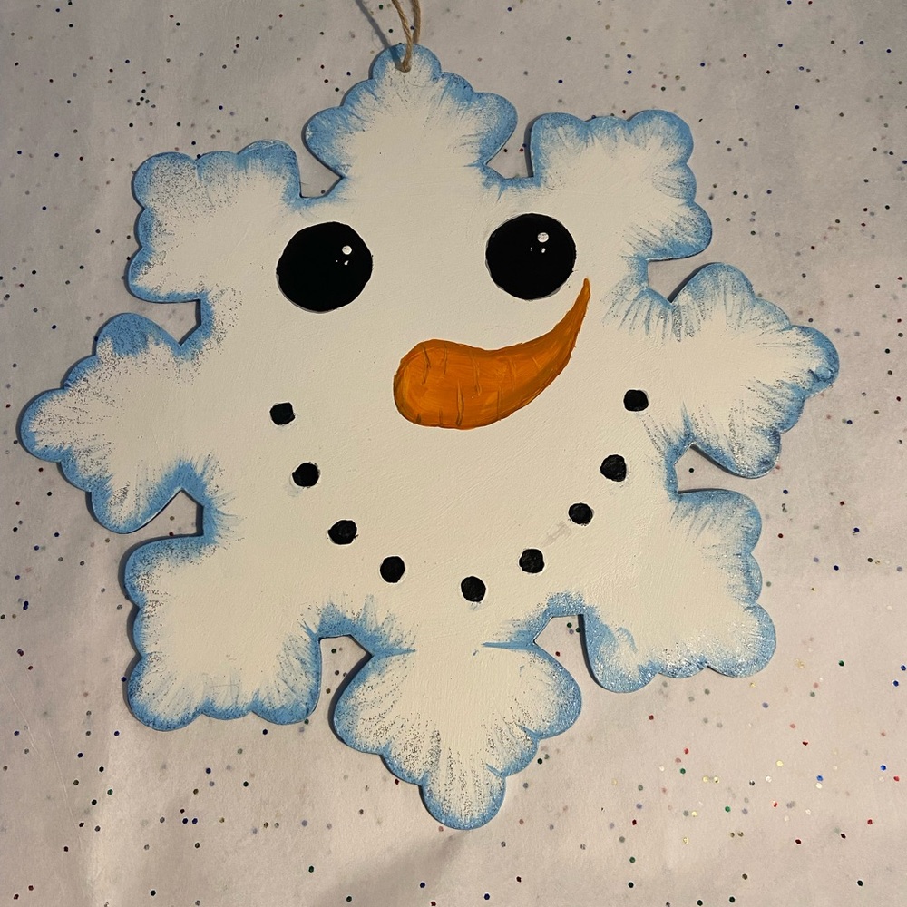 Wooden snowflake painting of a snowman face both sides painted